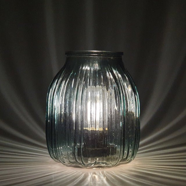 This peaceful blue lamp with lined glass detailing and a beautiful round ovoid shape creating a elegant and classy look  