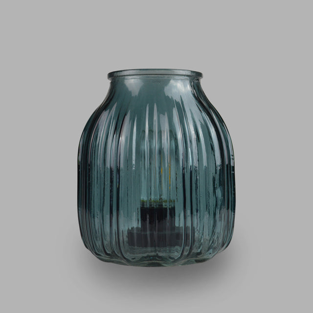 This peaceful blue lamp with lined glass detailing and a beautiful round ovoid shape creating a elegant and classy look  