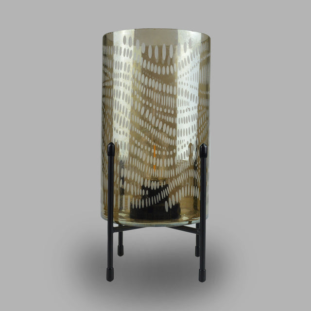 This large modern lamp sits on a slim black stand, allowing light to escape from all directions. Its spotted design replicates a forest, and its smoke grey colouring adds a touch of dark comfort.