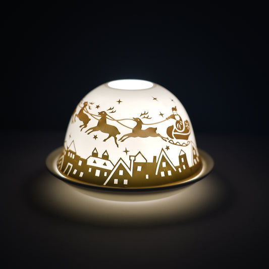 Cello porcelain tealight holder dome, in our sleigh bells design. This design displays Santa‚s sleigh and reindeer flying over a town at night. We offer a wide range of porcelain tealight holders to let you choose your show stopping piece and show it off with pride when guests and family are over.  Pick your preferred option between LED lights or using tealight candles. 