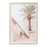 Framed palm tree print with glass front and hooks for hanging