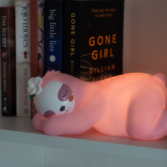 Sleeping sloth-shaped pink night light. These newest Night Lights are set to be an incredible decor addition to any little ones room and an amazing gift idea for all occasions - birthdays, christenings, holidays, and just because! 
